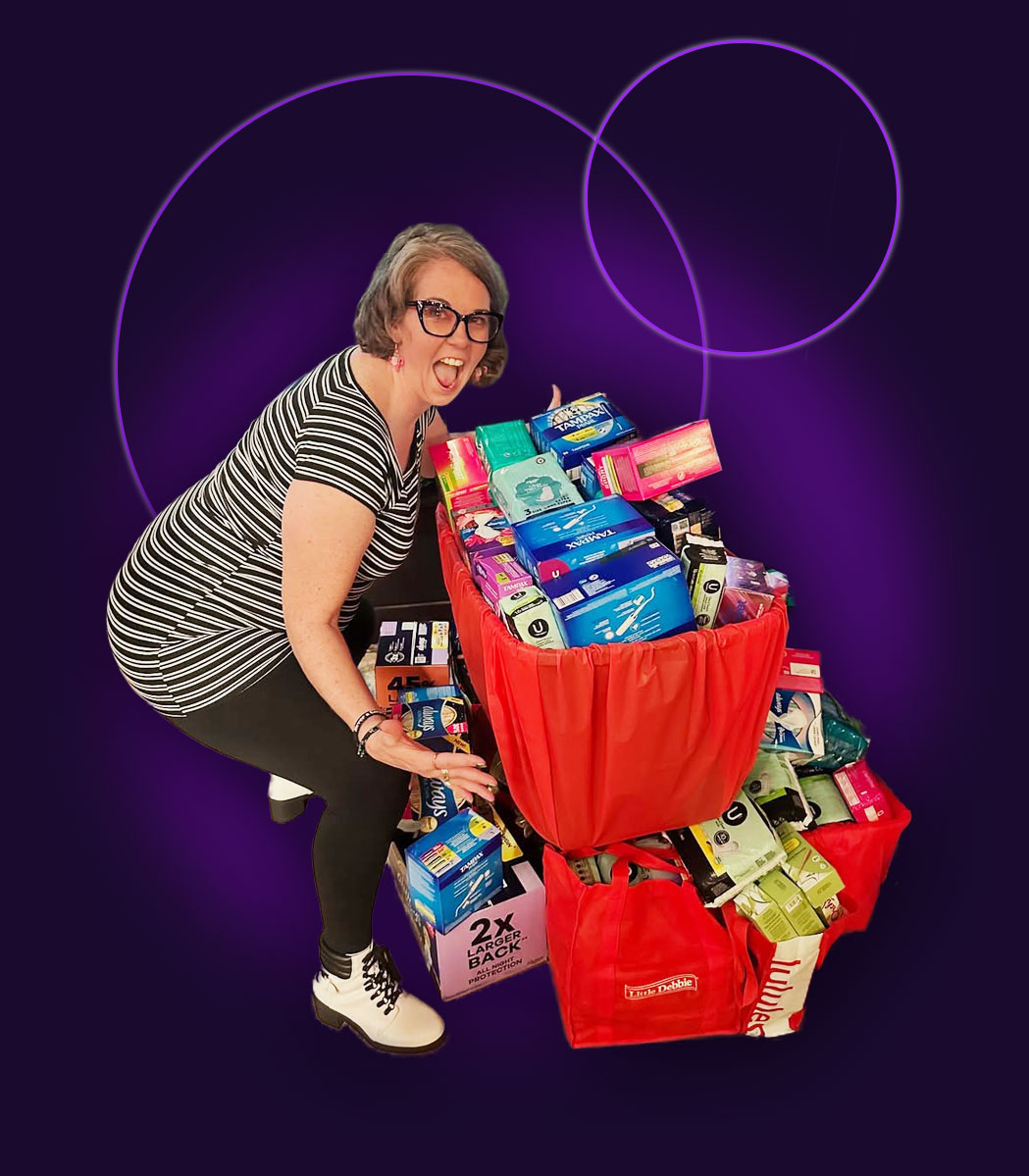 Bridgette Martin with a haul of period product donations